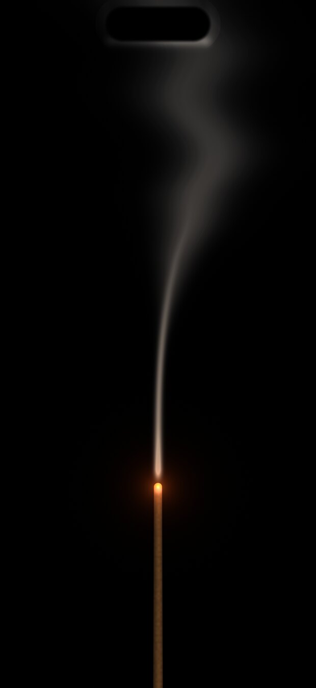 Smoke rising from the incense stick